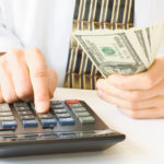 Man solving using his calculator